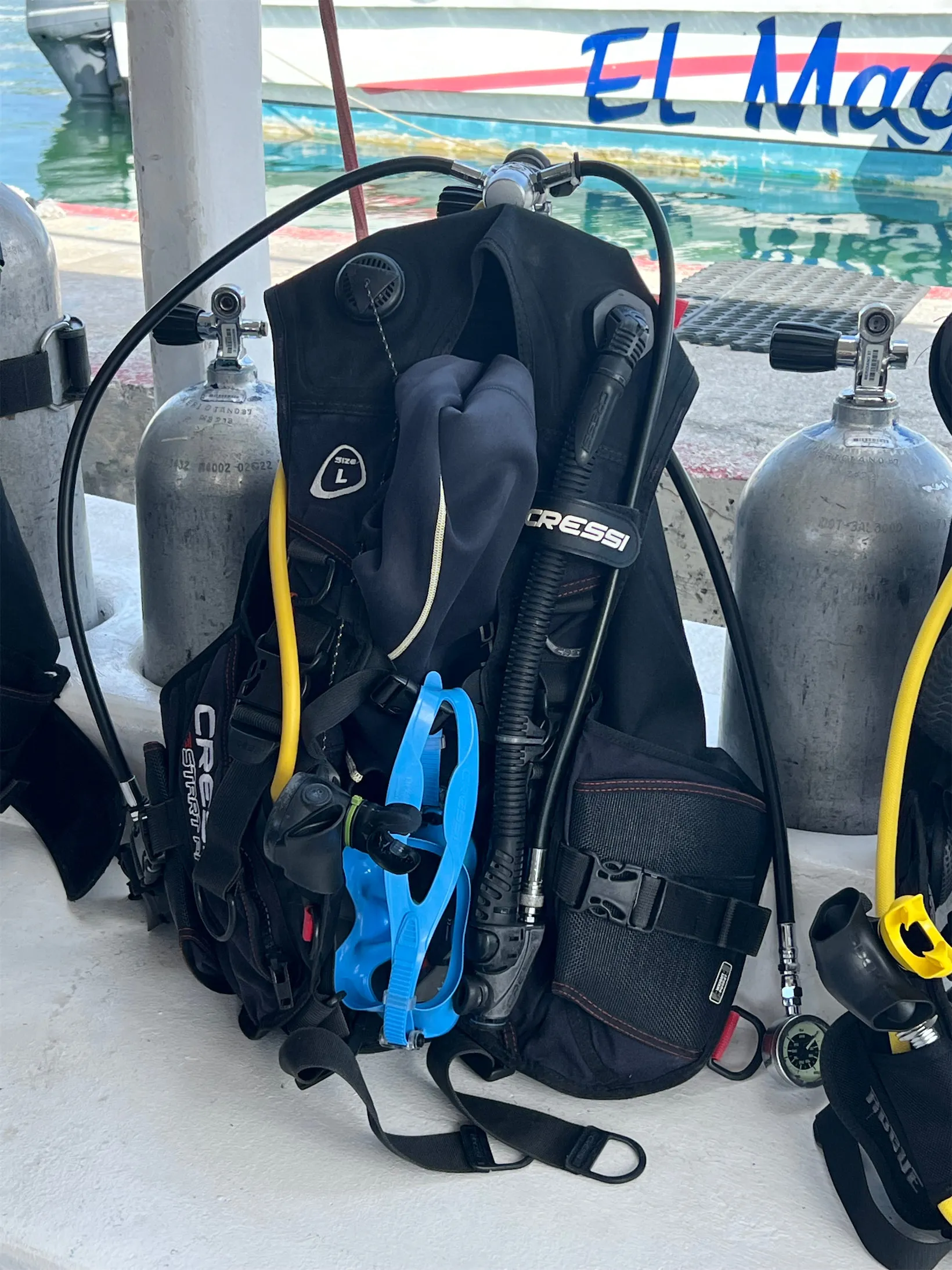 Scuba gear rigged and ready on the deck of a Cozumel dive boat