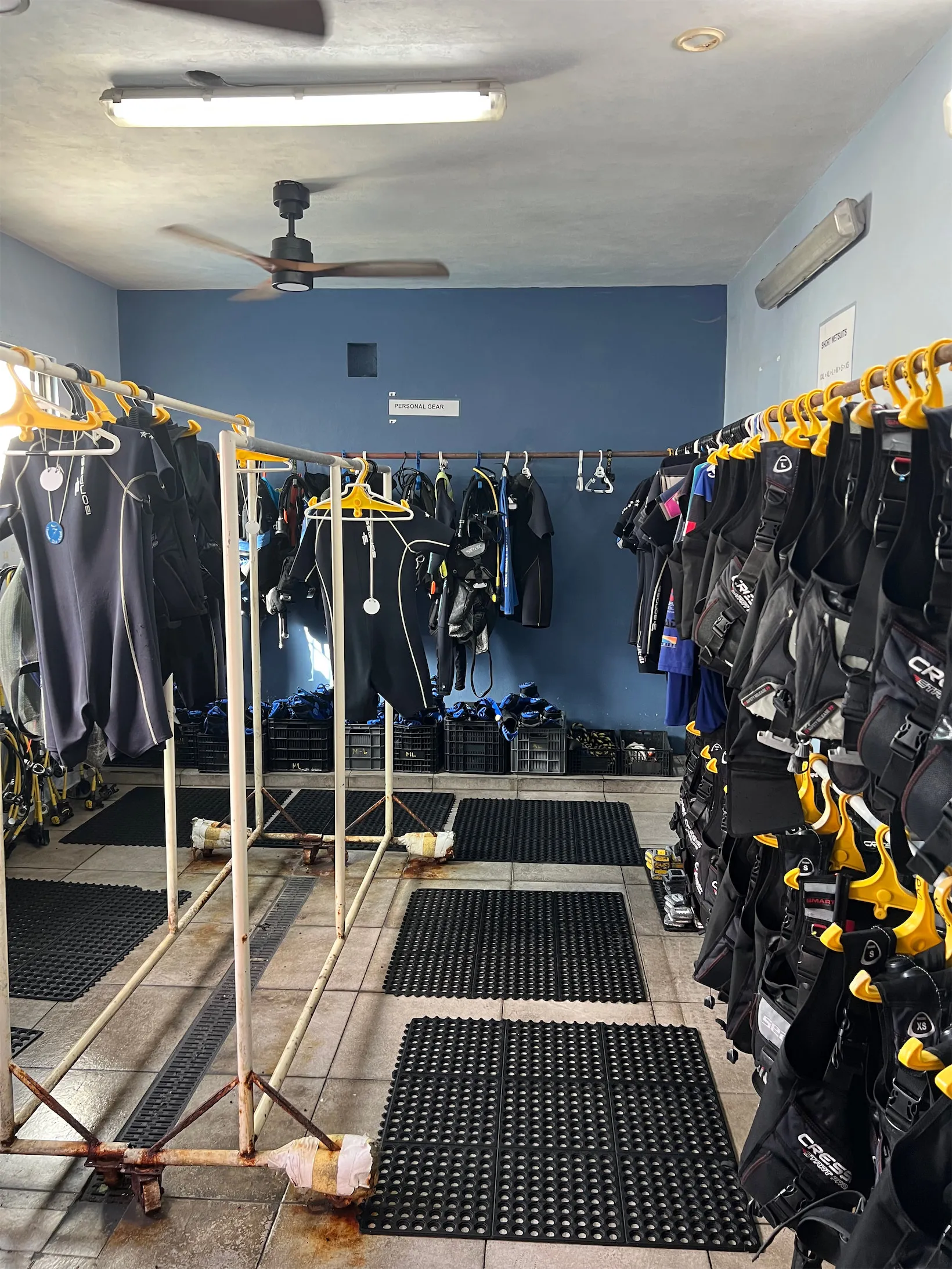 Wetsuits and BCDs on the racks at Cozumel Dive School