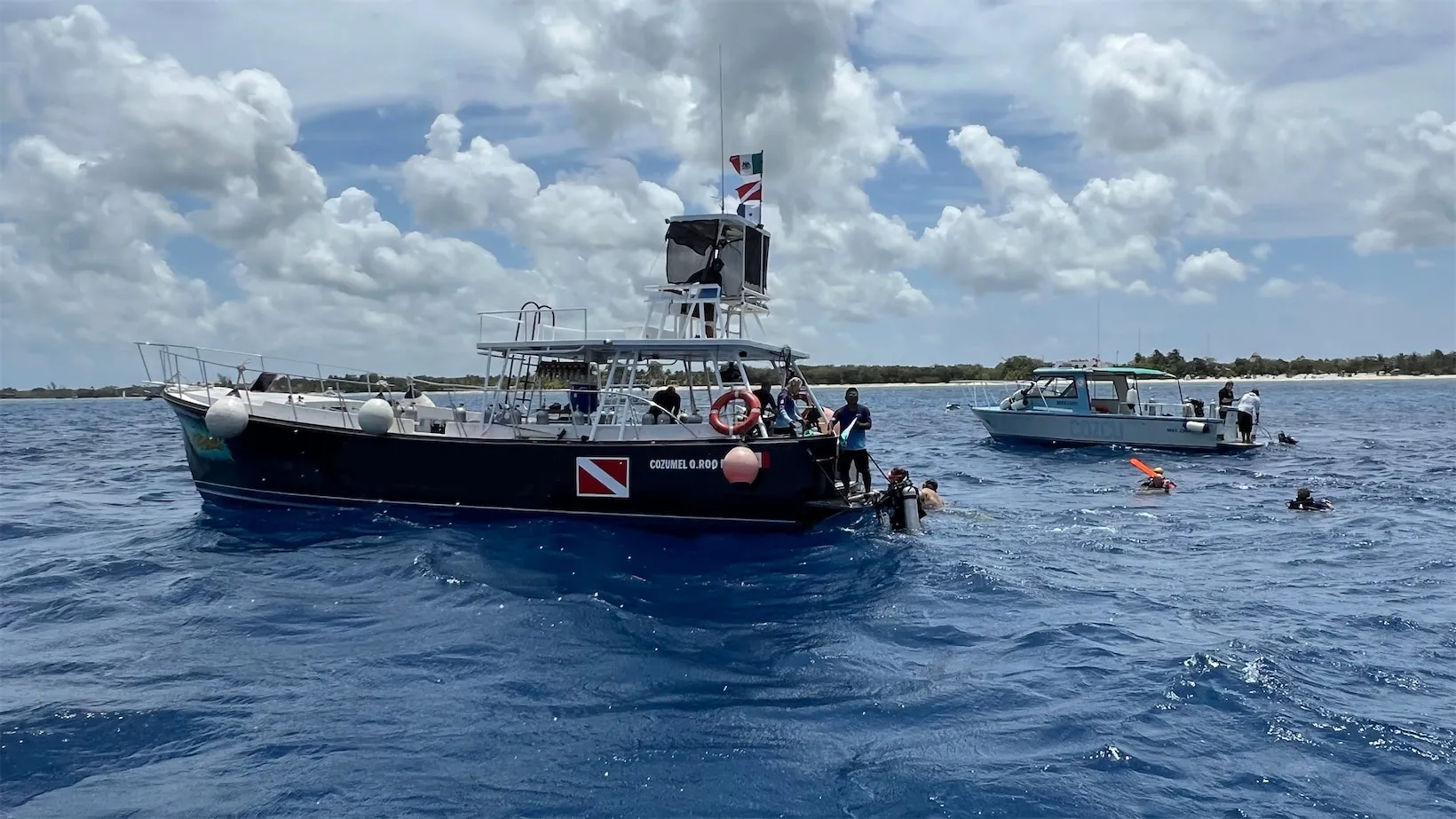 Dive boats picking up their divers over Tormentos Reef in Cozumel